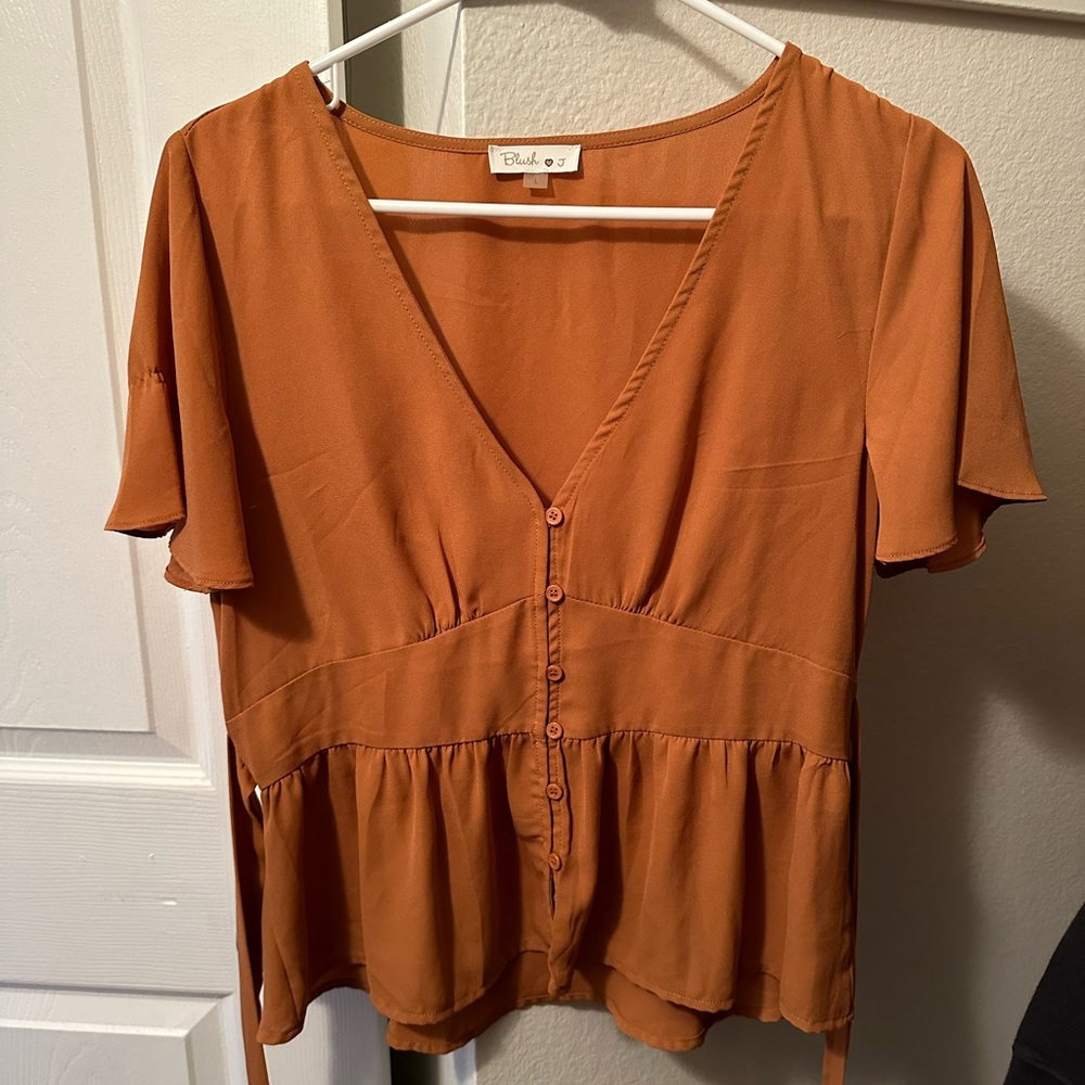Burnt orange flowy button up top. Only worn once.